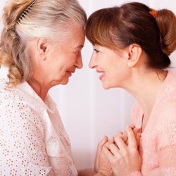 daughter and senior mother embrace