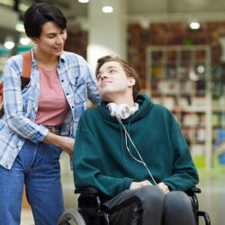 Mother with adult son in wheelchair