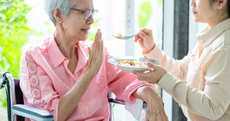 elderly woman refuses food