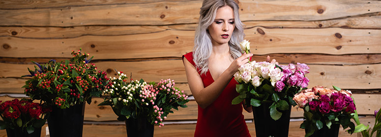 woman arranging flower bouquets