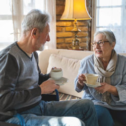 hospice chaplain talks with male patient